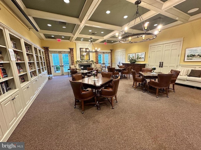 carpeted dining area with french doors, coffered ceiling, beam ceiling, and a notable chandelier