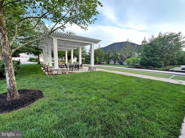 view of yard featuring a pergola and a mountain view