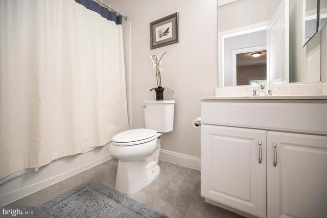 full bathroom featuring tile patterned flooring, vanity, shower / tub combo, and toilet