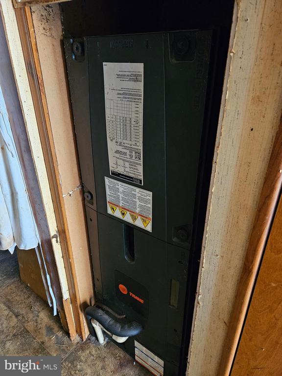 utility room with heating unit