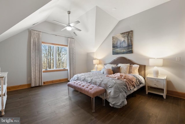 bedroom with lofted ceiling, wood finished floors, and baseboards