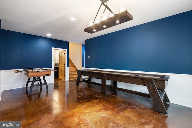 recreation room with concrete flooring, recessed lighting, and baseboards