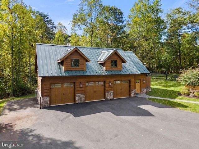 garage with driveway and fence