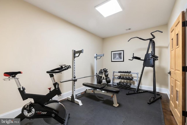 workout room with baseboards