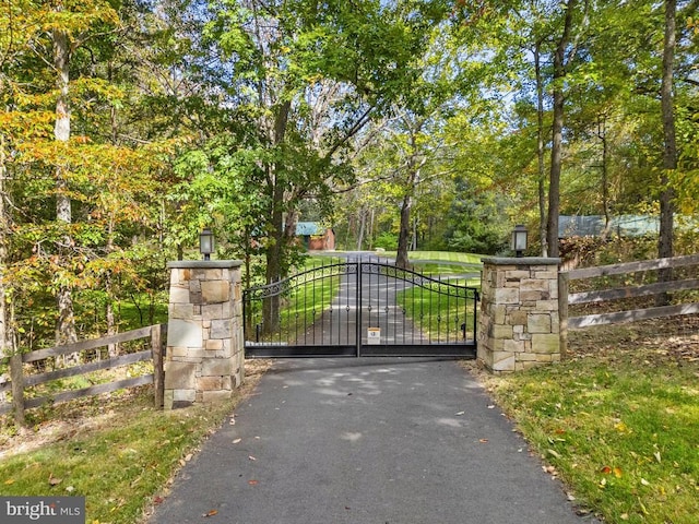 view of gate with fence