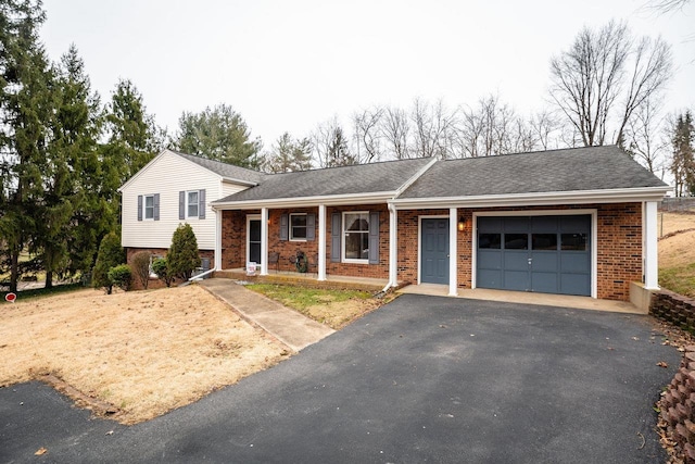 view of front of home featuring a garage and covered porch