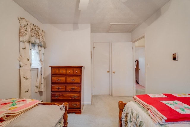 bedroom featuring light carpet and ceiling fan