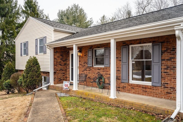 split level home featuring covered porch