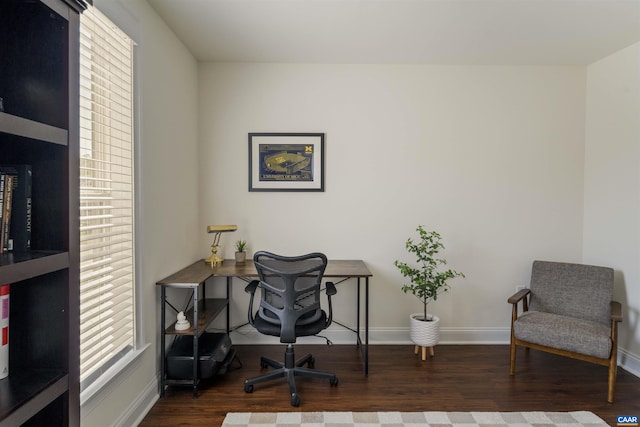 office area with baseboards and wood finished floors