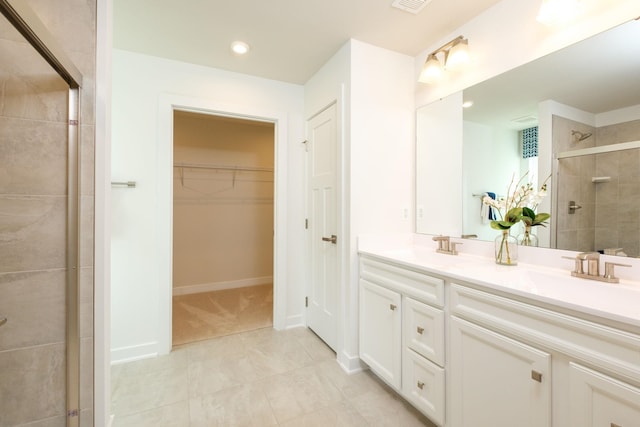 bathroom featuring vanity and walk in shower