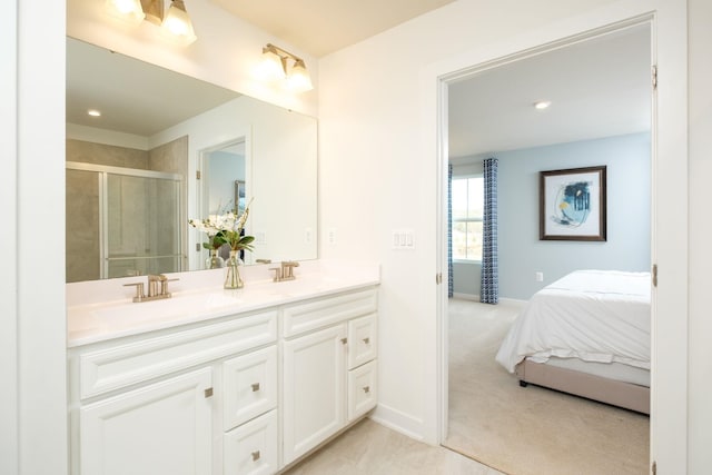 bathroom featuring vanity and a shower with shower door