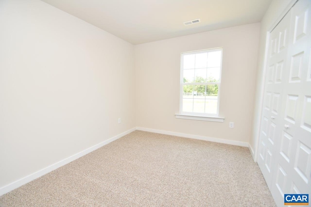 unfurnished room featuring carpet floors