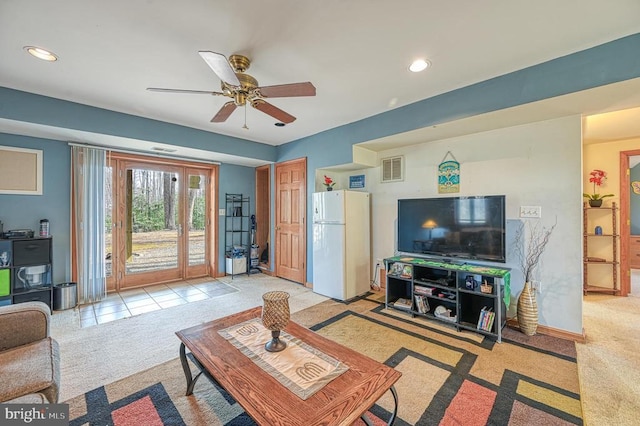 living room featuring recessed lighting, light carpet, a ceiling fan, baseboards, and visible vents