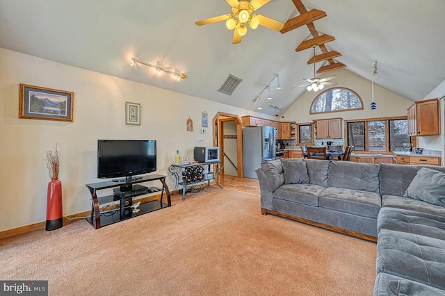 living room with light carpet, high vaulted ceiling, beamed ceiling, and visible vents