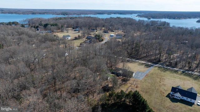 aerial view featuring a water view and a forest view