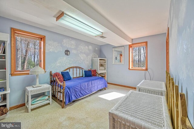 carpeted bedroom with baseboards