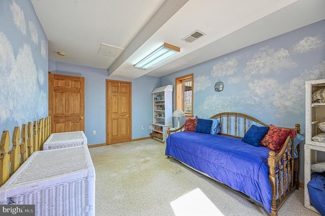 carpeted bedroom featuring baseboards, visible vents, and wallpapered walls