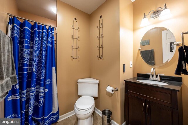 bathroom with a shower with shower curtain, vanity, toilet, and tile patterned flooring