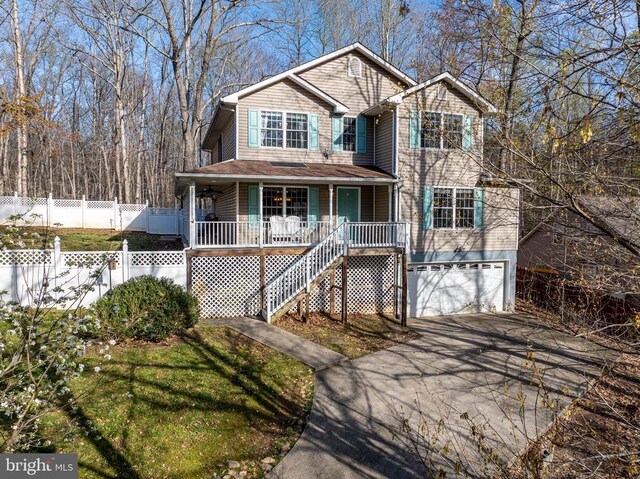 view of front facade with a garage and covered porch