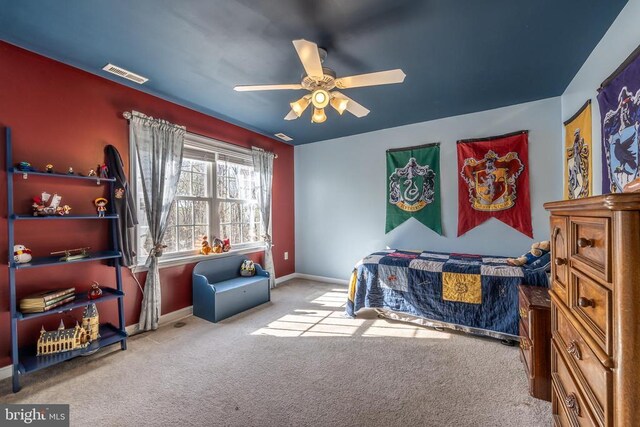 bedroom with light carpet and ceiling fan