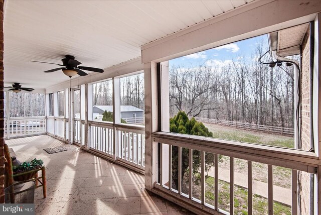 sunroom / solarium with ceiling fan