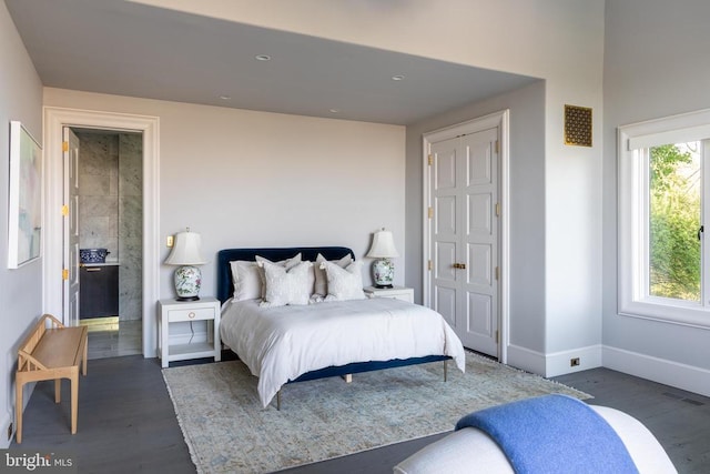 bedroom with wood finished floors, recessed lighting, visible vents, and baseboards