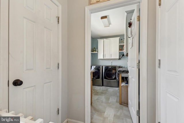 bathroom featuring independent washer and dryer