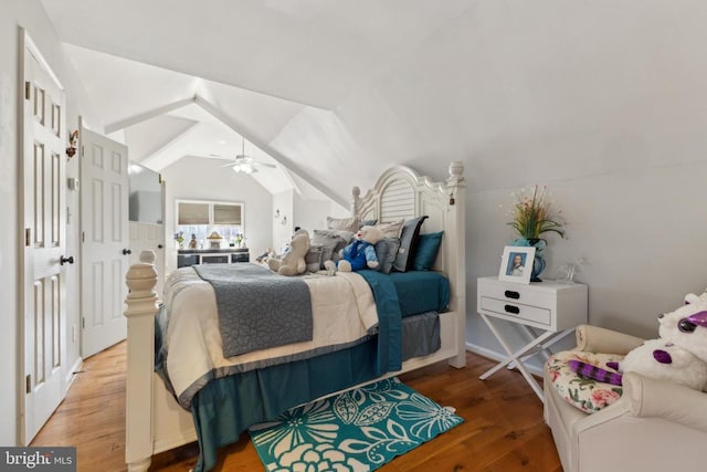 bedroom with vaulted ceiling, ceiling fan, and wood finished floors