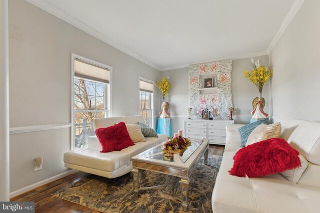 living area with ornamental molding, dark wood-style flooring, and baseboards