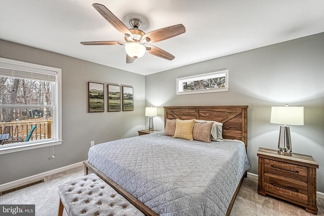 bedroom with a ceiling fan, carpet, visible vents, and baseboards