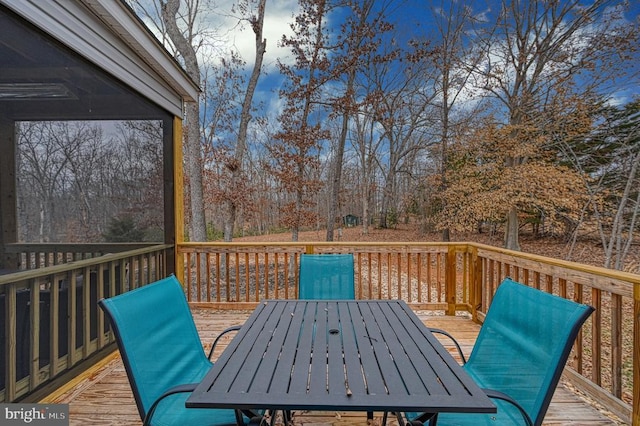 deck with outdoor dining area