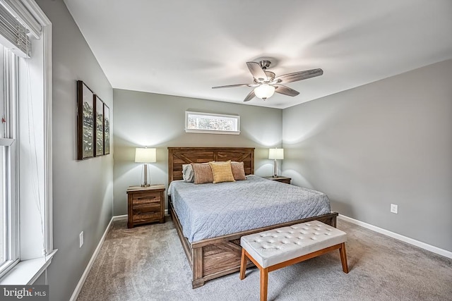 carpeted bedroom featuring a ceiling fan and baseboards