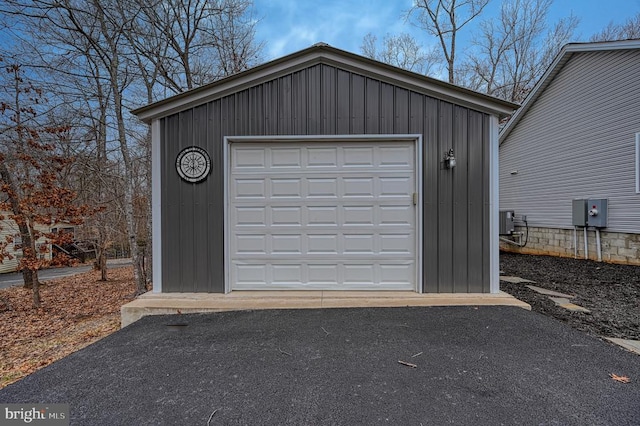 detached garage with aphalt driveway