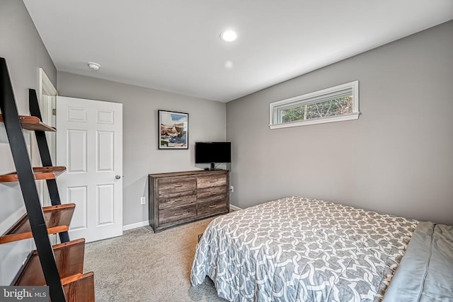 carpeted bedroom featuring recessed lighting and baseboards