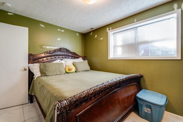 bedroom with a textured ceiling