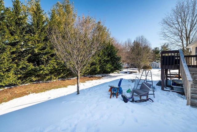 view of yard layered in snow