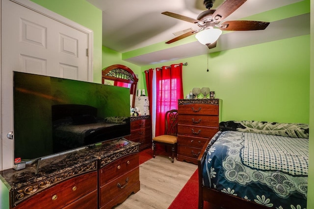 bedroom with ceiling fan and light hardwood / wood-style flooring