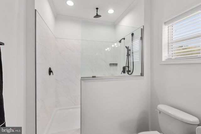 bathroom with a walk in shower, toilet, recessed lighting, and crown molding