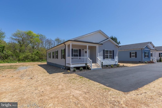 view of front of property with covered porch and crawl space