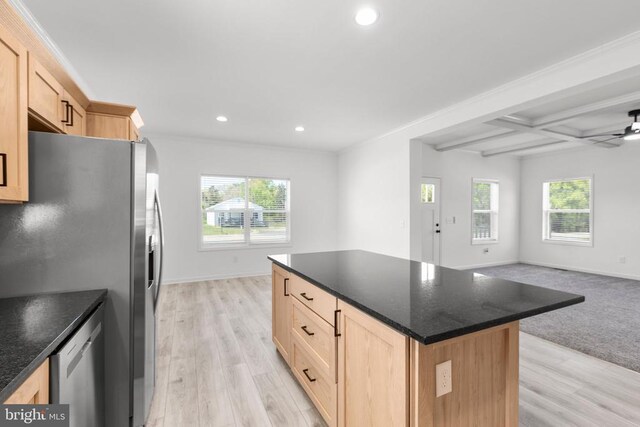 kitchen featuring light brown cabinetry, recessed lighting, open floor plan, and appliances with stainless steel finishes