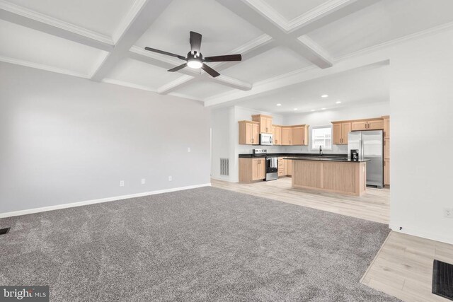 unfurnished living room with beamed ceiling, coffered ceiling, a ceiling fan, and ornamental molding