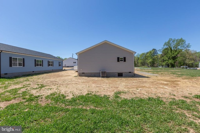 view of side of property with crawl space
