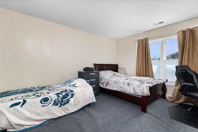 bedroom featuring carpet and visible vents