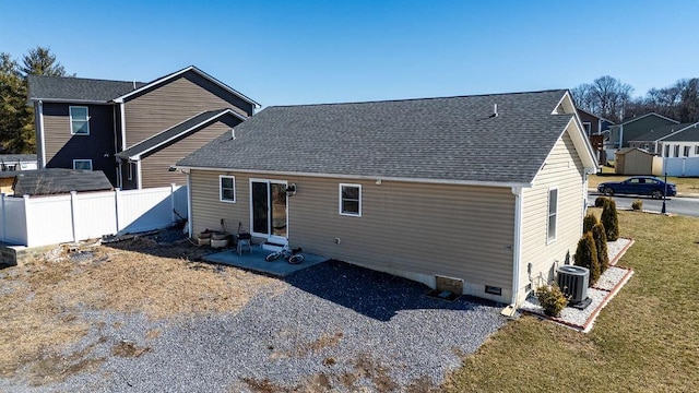 back of house with central AC unit, crawl space, fence, a yard, and a patio area