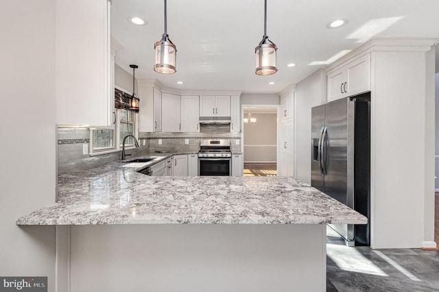 kitchen featuring pendant lighting, a peninsula, white cabinetry, and stainless steel appliances