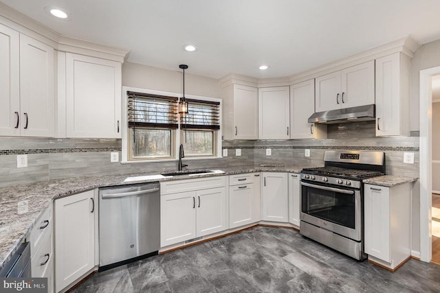 kitchen featuring appliances with stainless steel finishes, white cabinetry, a sink, and under cabinet range hood