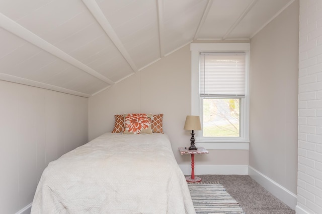 bedroom featuring vaulted ceiling and carpet