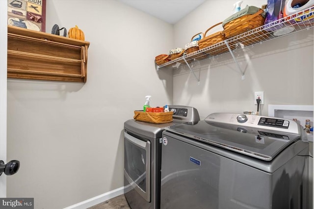 laundry room with independent washer and dryer