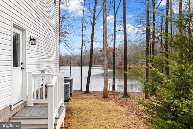 wooden terrace featuring a water view