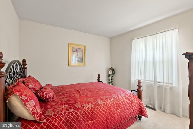 bedroom with multiple windows, carpet, and visible vents